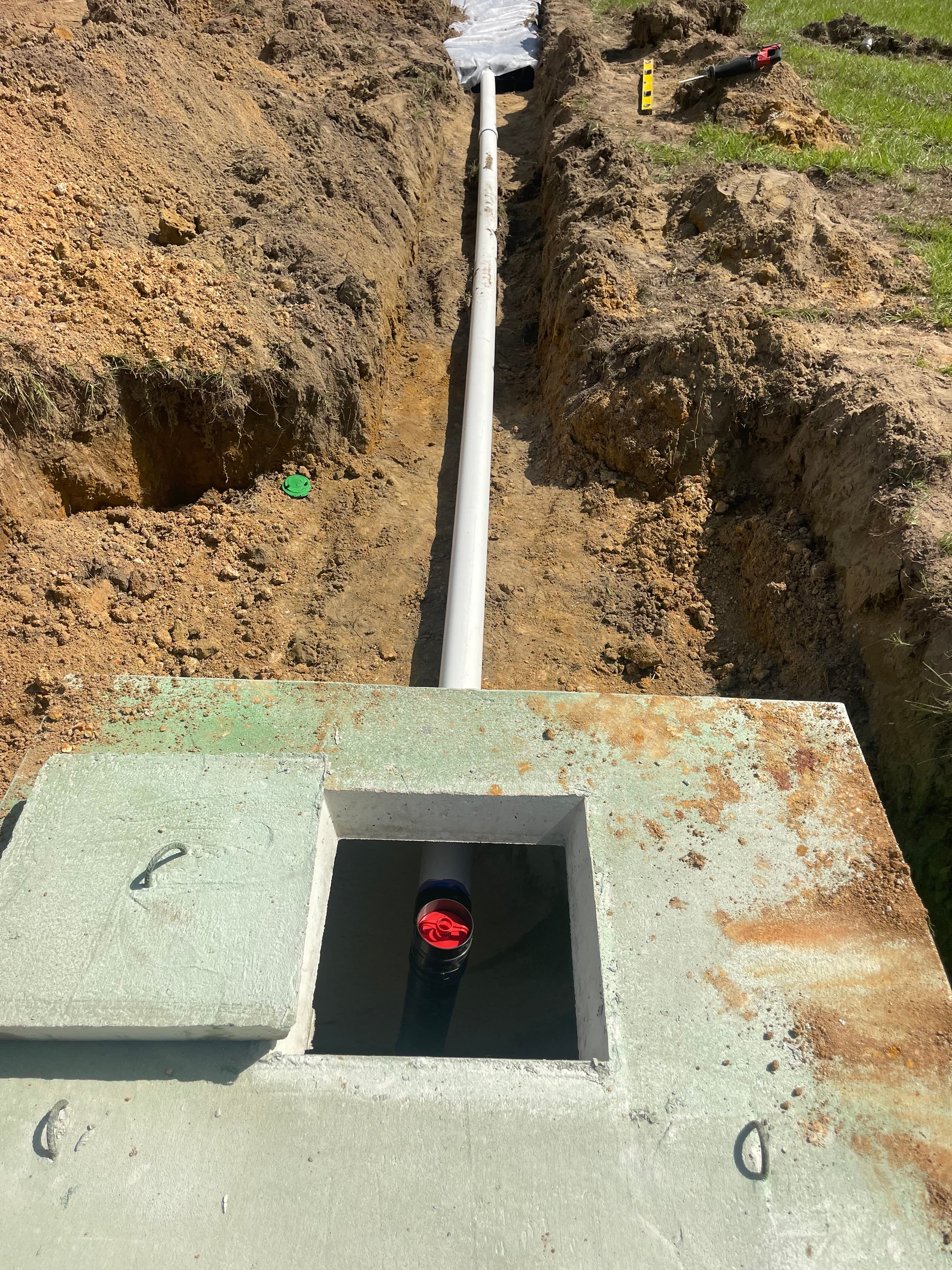 Open access lid on a concrete septic tank